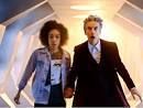 Meet the new companion; Pearl Mackie, tall dark-skinned woman as Bill, with Peter Capaldi as Doctor Who in a white corridor.